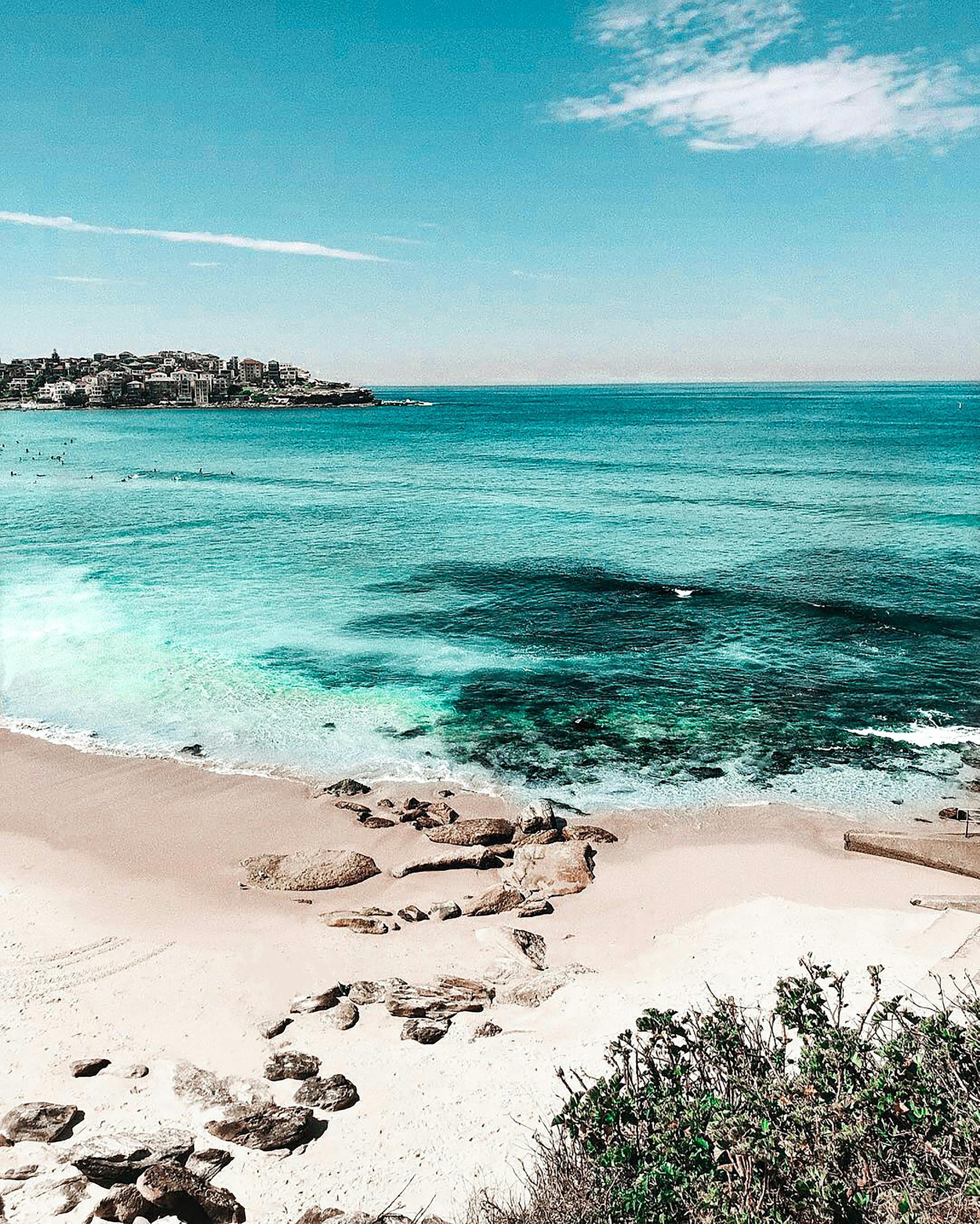 A stunning view of Bondi Beach with turquoise waters and clear skies in Sydney, Australia.