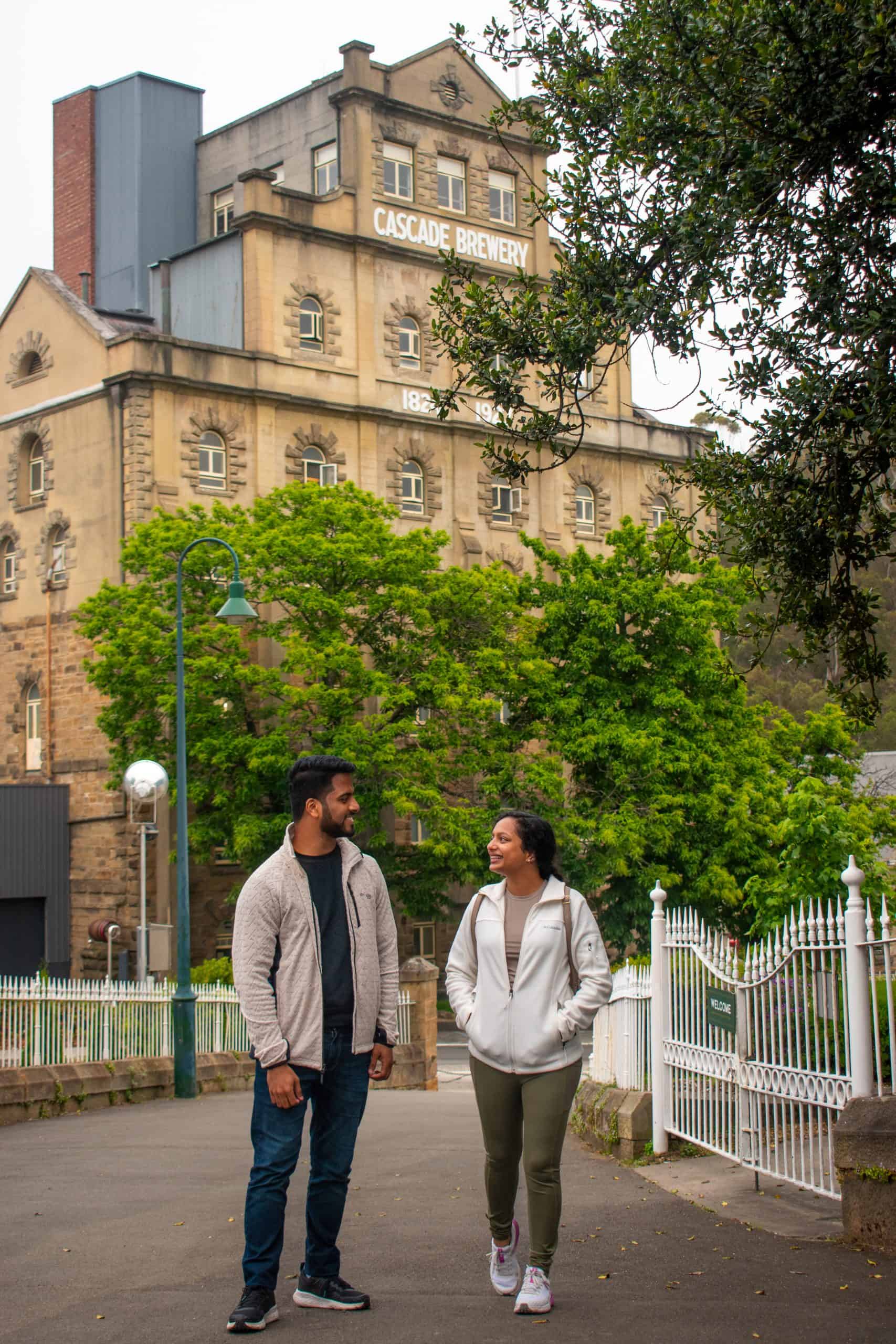 Image: Cascade Brewery Tour
Visitors enjoying a guided tour of Cascade Brewery, Australia's oldest brewery, showcasing the historic sandstone building and lush gardens.