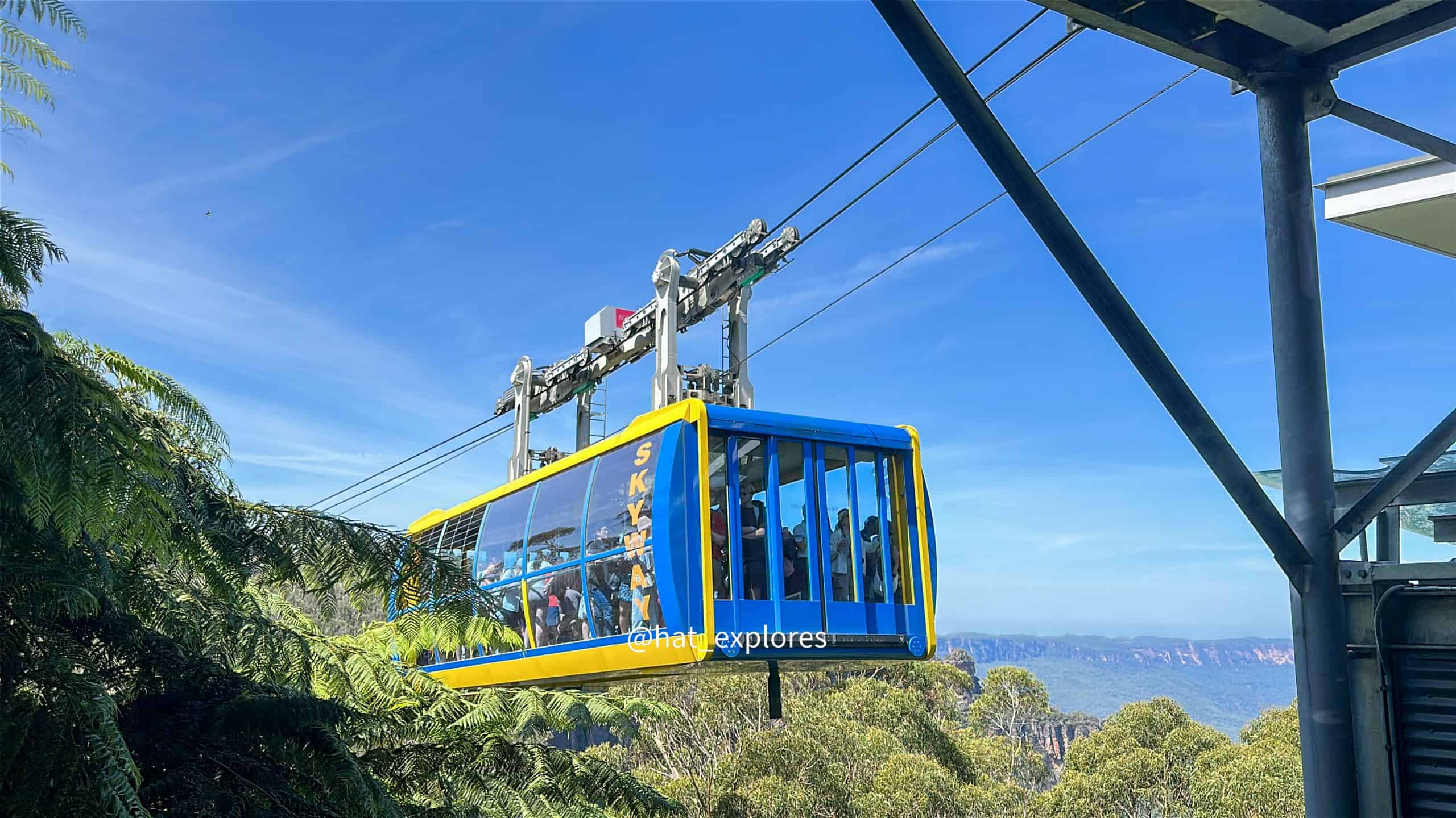 Cable car ride over lush forest and scenic landscape at Skyway.