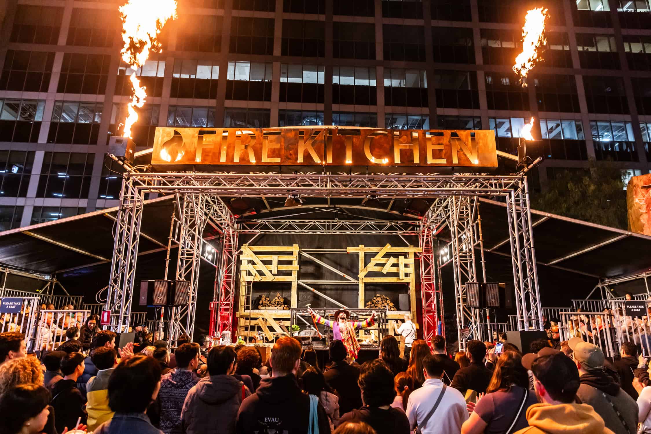 A fiery and dramatic culinary display at Vivid Sydney’s Fire Kitchen, where chefs showcase their skills with open flames and illuminated food presentations.