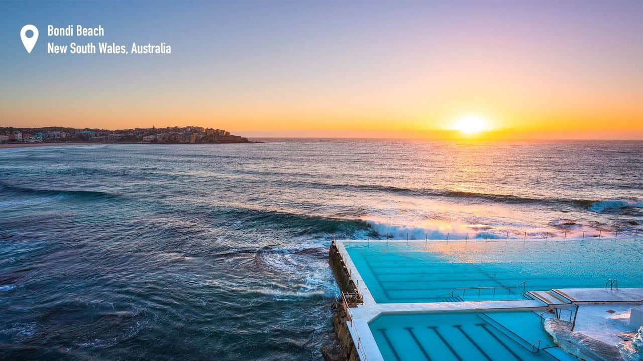 Morning sun rising over Bondi Icebergs, Bondi Beach.
