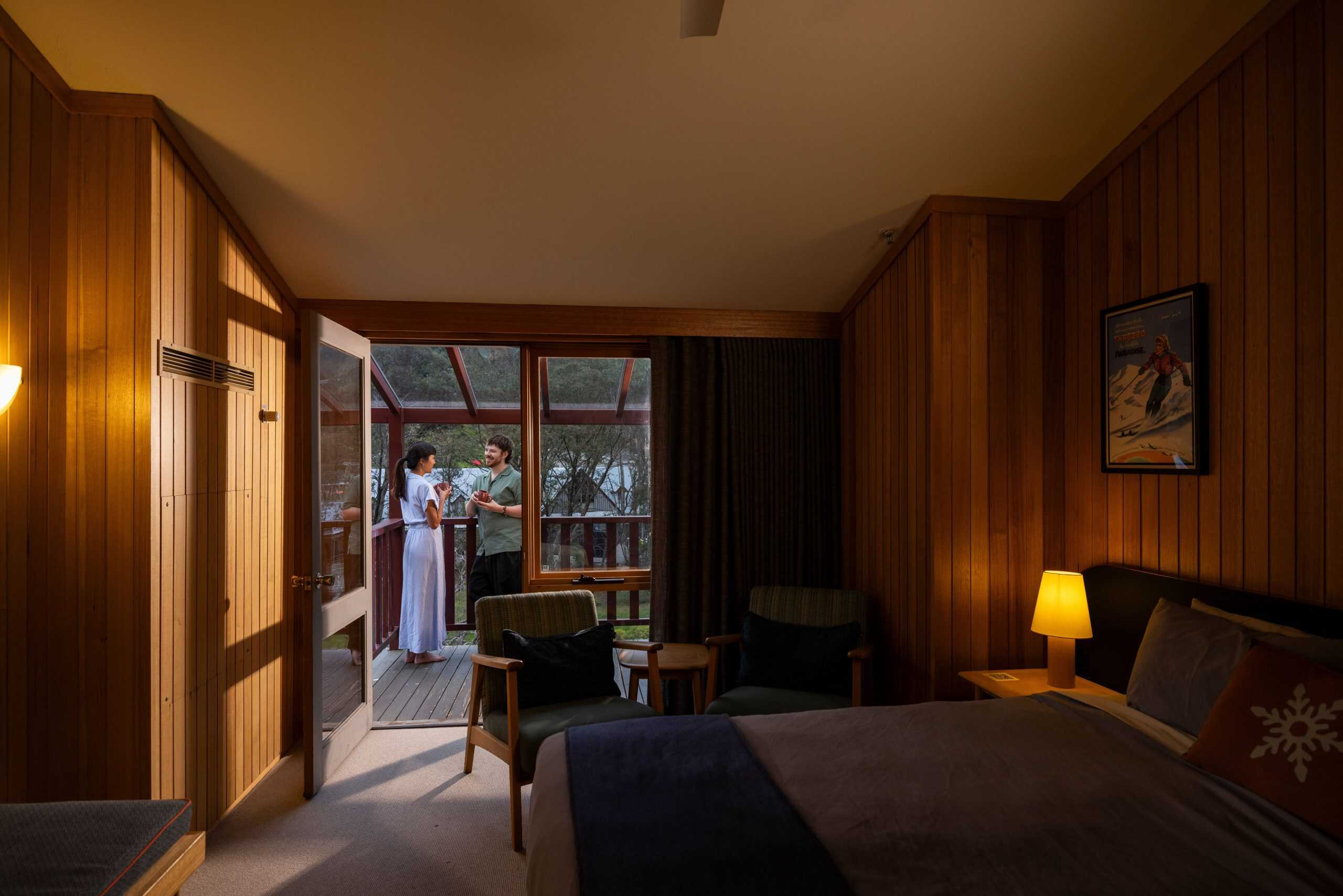 A couple enjoys the terrace at the Thredbo Alpine Hotel, Thredbo, Snowy Mountains!