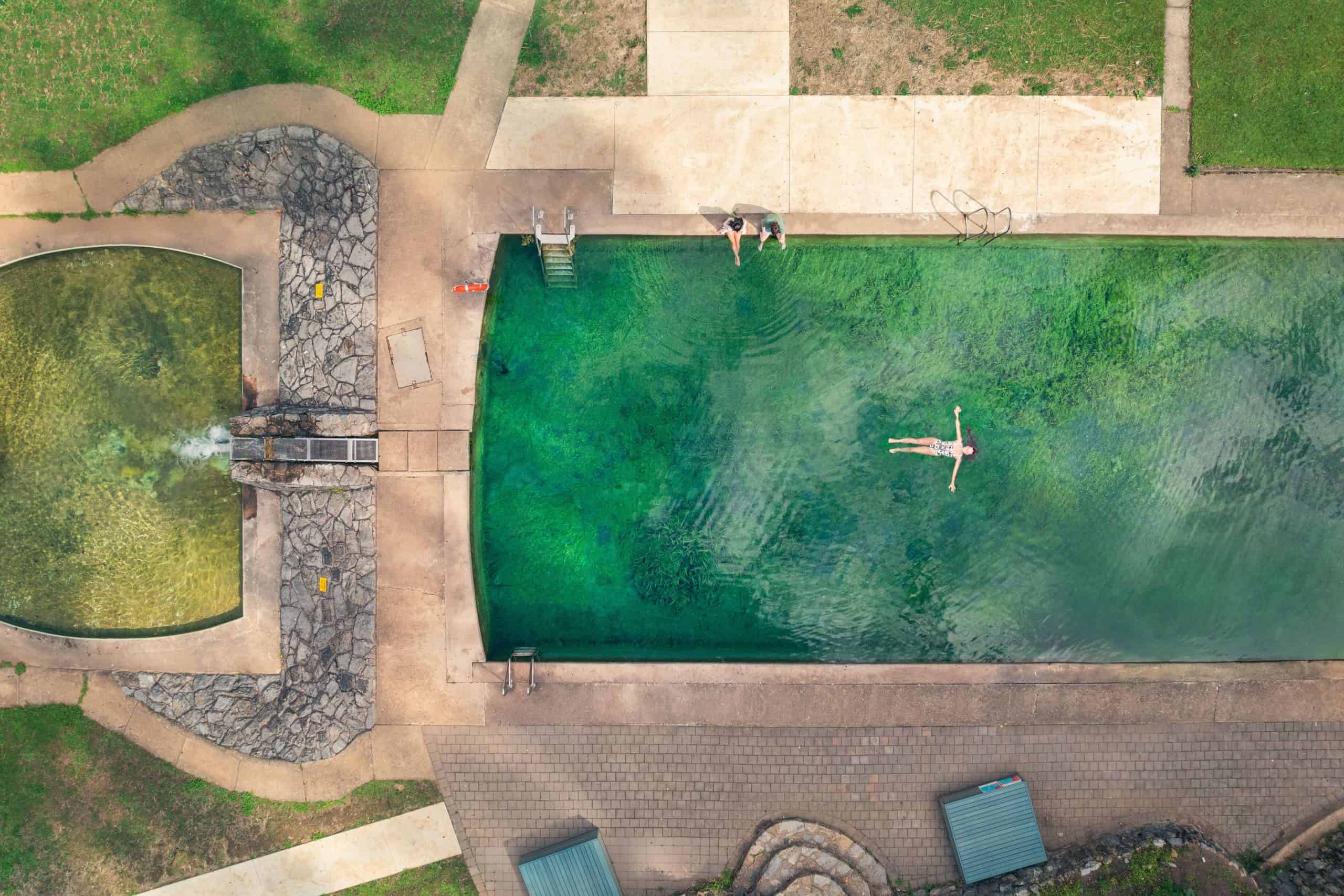 Couple explores the Yarranobilly Caves Thermal Pool, Yarrangobilly, Snowy Mountains