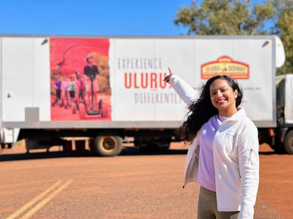 Visitors enjoying a guided Desert Segway Tour around the red desert landscapes near Uluru.
